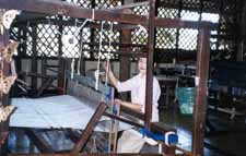 Thai woman weaving silk cloth